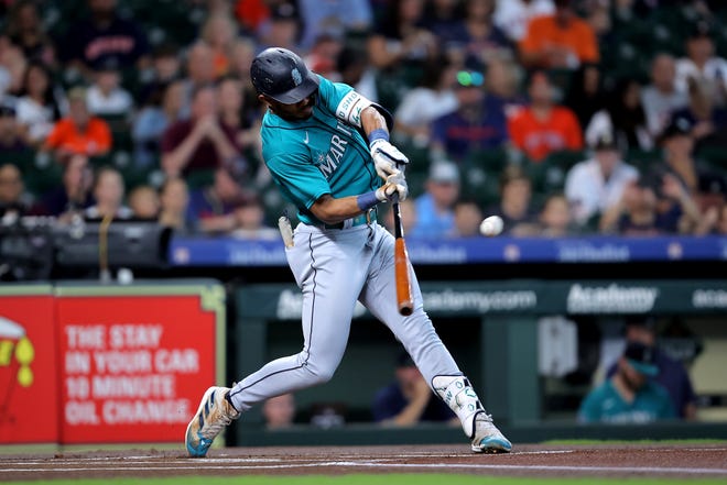 Seattle Mariners quarterback Julio Rodriguez scores a touchdown at right field against the Houston Astros during a game on August 20, 2023.